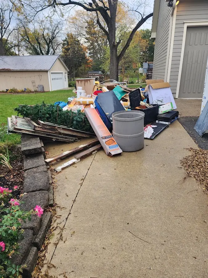Dumpster being loaded with debris for 3 Yard Dumpster Rental in Elmwood Park